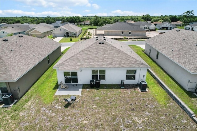 457 W Fairways View Dr, Beverly Hills, FL 34465 - rear view of house with a residential view, central AC, stucco siding, and a shingled roof