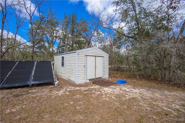 view of shed with solar panels