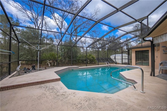 outdoor pool with a lanai and a patio