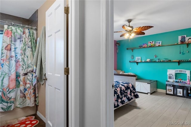 bedroom featuring ceiling fan and light wood-type flooring