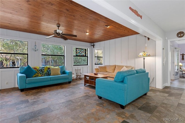 living room with wood ceiling and ceiling fan