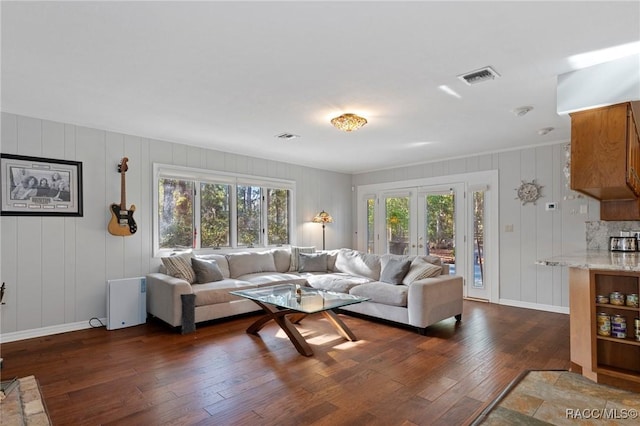 living room featuring dark wood-type flooring and french doors