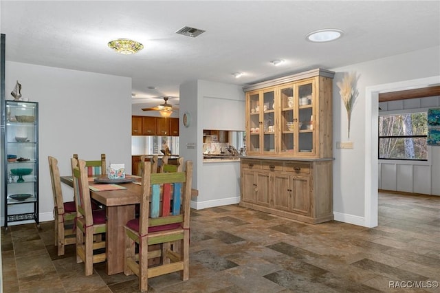 dining area with ceiling fan