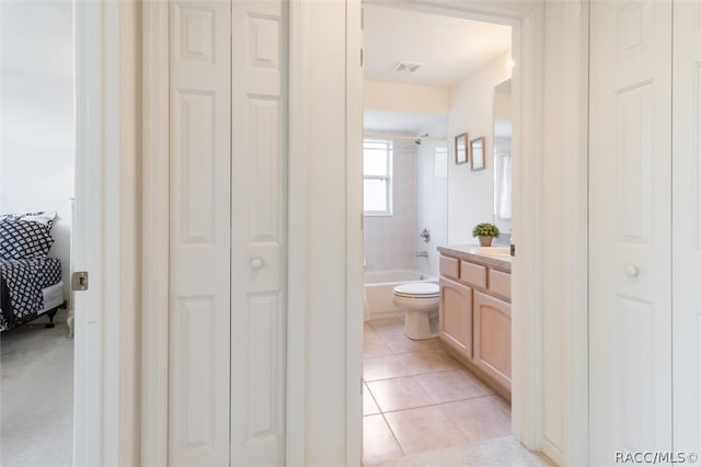 full bathroom featuring tile patterned flooring, shower / tub combination, vanity, and toilet