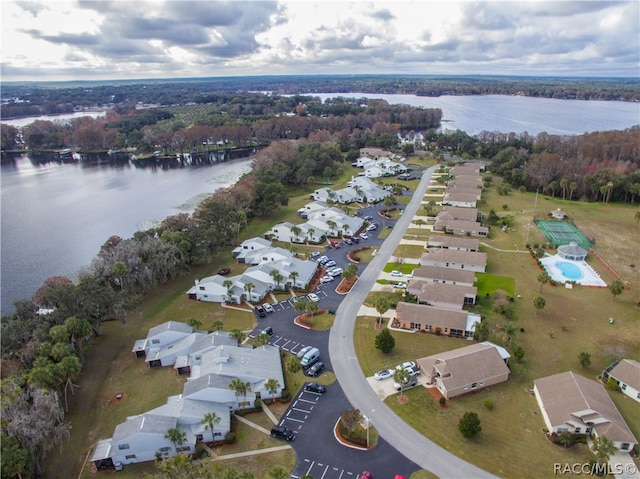 birds eye view of property with a water view