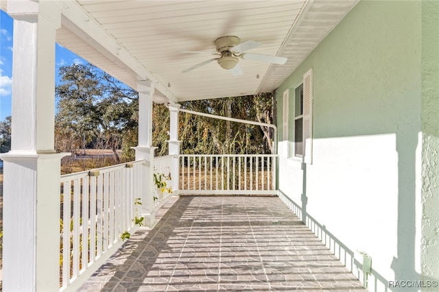 view of patio featuring ceiling fan and a porch