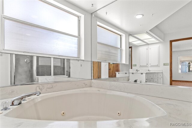 17469 SW 35th Ave, Roads, Ocala, FL 34473 - bathroom with a tub with jets and vanity