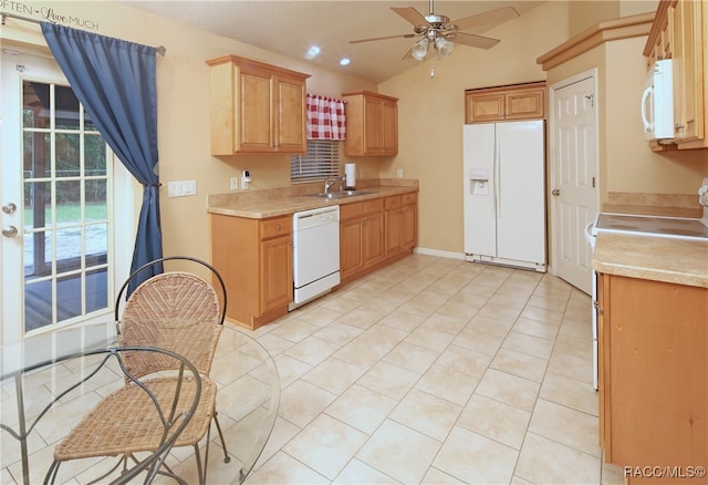 kitchen with ceiling fan, sink, vaulted ceiling, white appliances, and light tile patterned floors