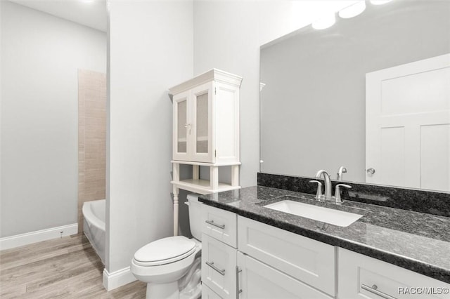 full bathroom featuring vanity, wood-type flooring,  shower combination, and toilet