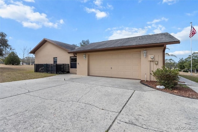 view of side of property featuring a garage