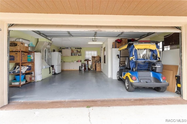 garage featuring white fridge