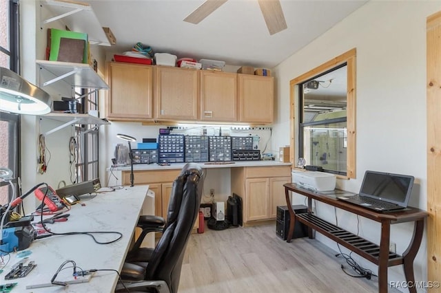 office area with light hardwood / wood-style floors and ceiling fan