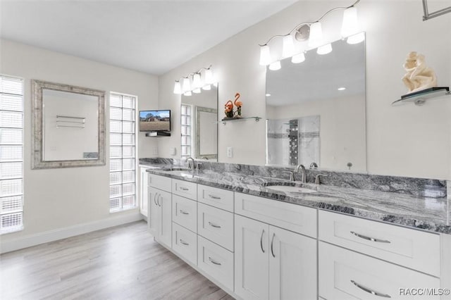 bathroom with vanity and hardwood / wood-style floors