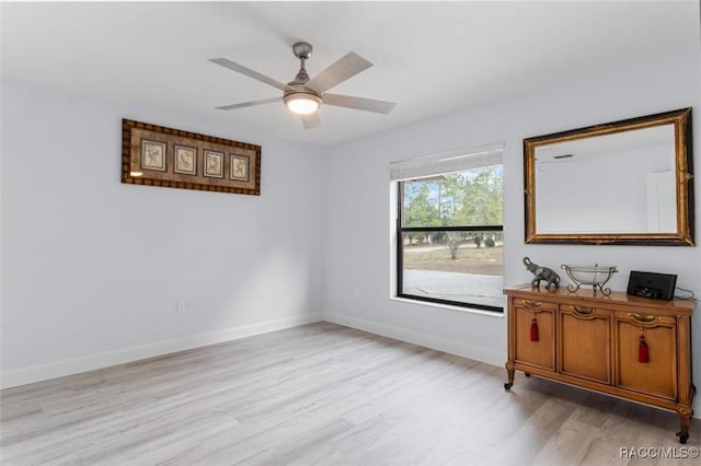 unfurnished room featuring ceiling fan and light hardwood / wood-style floors