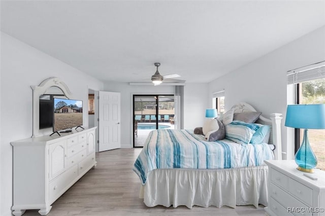 bedroom featuring access to exterior, ceiling fan, and light hardwood / wood-style flooring