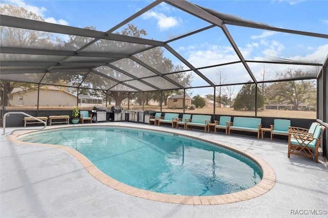 view of swimming pool with glass enclosure and a patio area