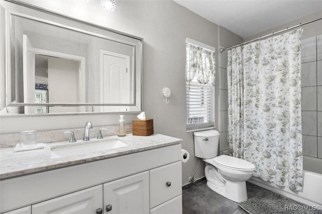 full bathroom featuring tile patterned flooring, vanity, shower / tub combo with curtain, and toilet