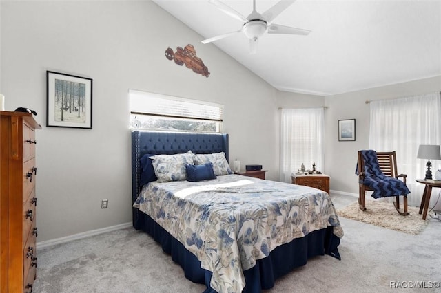 bedroom featuring ceiling fan, light colored carpet, and lofted ceiling