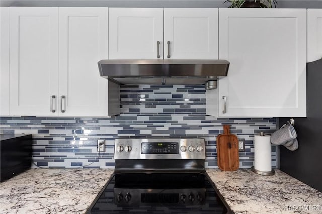 kitchen featuring backsplash, light stone counters, stainless steel electric range, and white cabinets