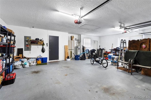 garage with a garage door opener, electric water heater, and electric panel