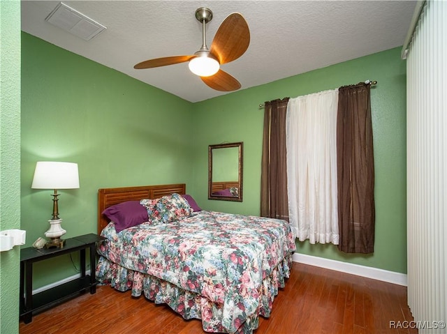 bedroom featuring ceiling fan and wood-type flooring