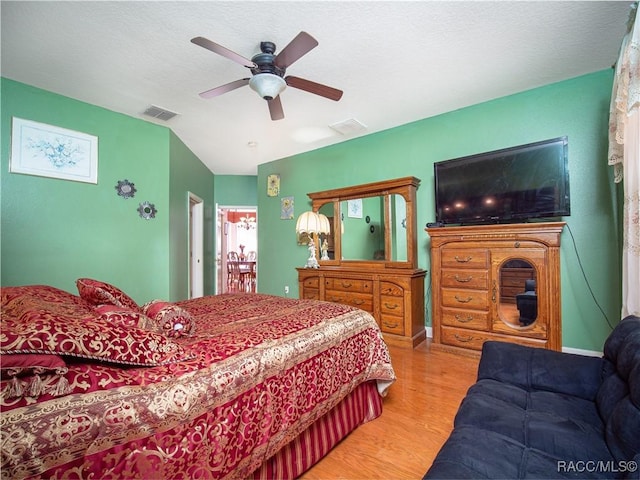 bedroom featuring ceiling fan and light hardwood / wood-style floors