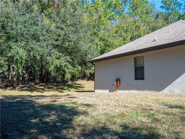 view of home's exterior featuring a yard