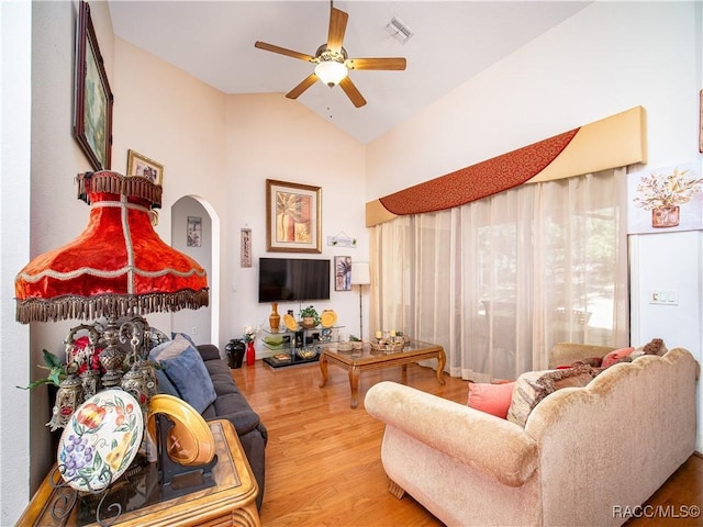 living room with vaulted ceiling, ceiling fan, and hardwood / wood-style floors