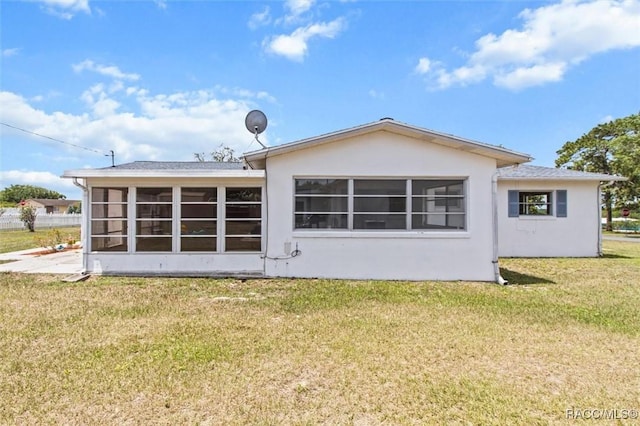 33 New York Blvd, Beverly Hills, FL 34465 - back of property featuring a sunroom, a yard, and stucco siding