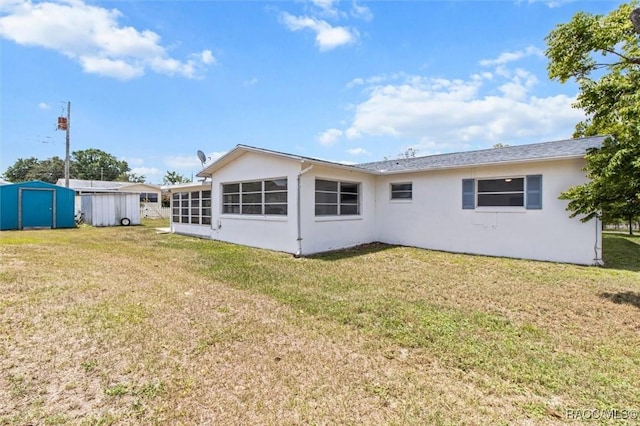 33 New York Blvd, Beverly Hills, FL 34465 - back of property with a shed, stucco siding, and a yard