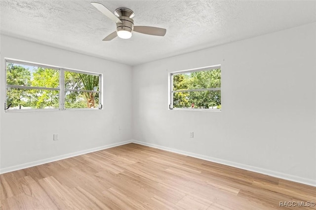 33 New York Blvd, Beverly Hills, FL 34465 - unfurnished room featuring light wood-style floors, a textured ceiling, and a ceiling fan