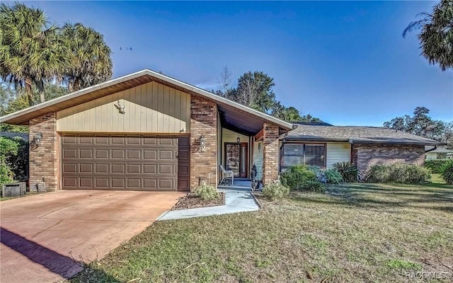 ranch-style house with a garage and a front lawn