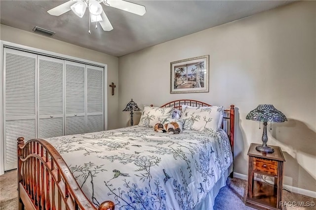 carpeted bedroom featuring a closet and ceiling fan