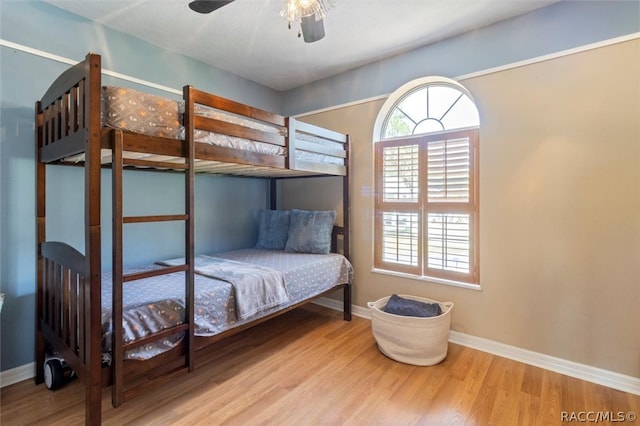 bedroom with ceiling fan and light hardwood / wood-style floors