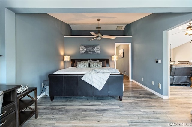 bedroom featuring hardwood / wood-style flooring and ceiling fan