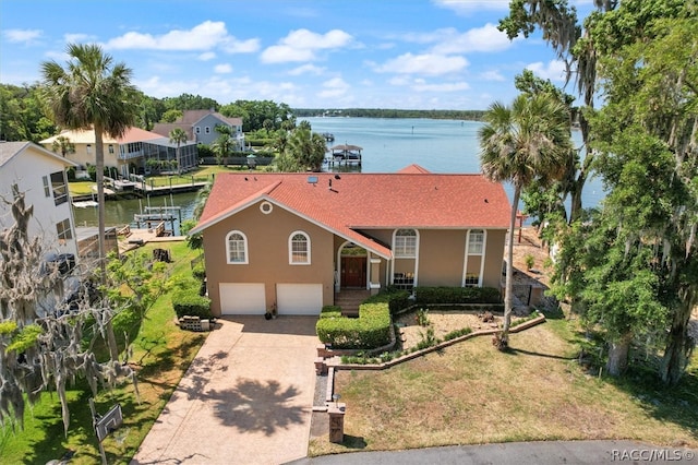 view of front of house featuring a water view and a garage