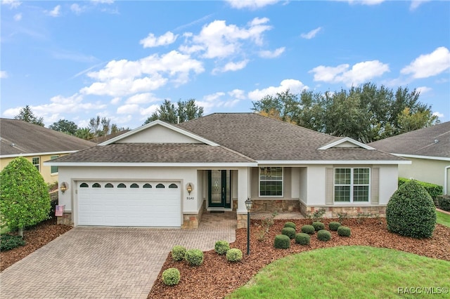 ranch-style house featuring a garage