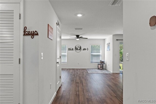 3192 W Barberton Pl, Citrus Springs, FL 34434 - hallway featuring dark wood finished floors and baseboards