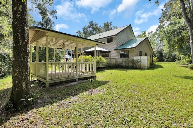 view of yard featuring a wooden deck