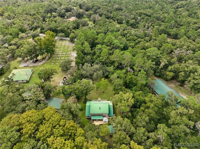 bird's eye view featuring a wooded view