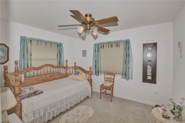 bedroom with carpet floors, ceiling fan, and baseboards