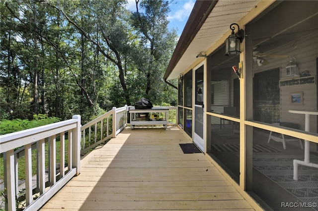 wooden terrace with a sunroom