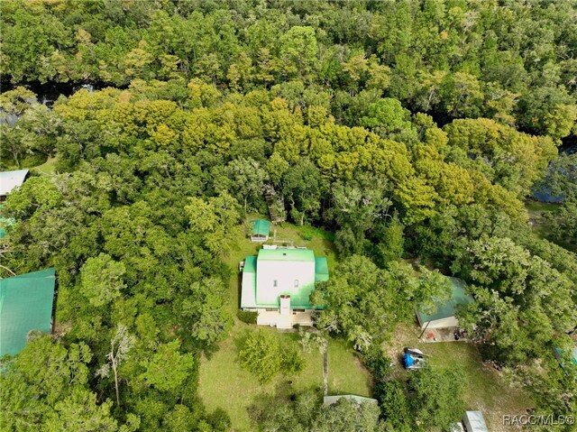 drone / aerial view featuring a view of trees