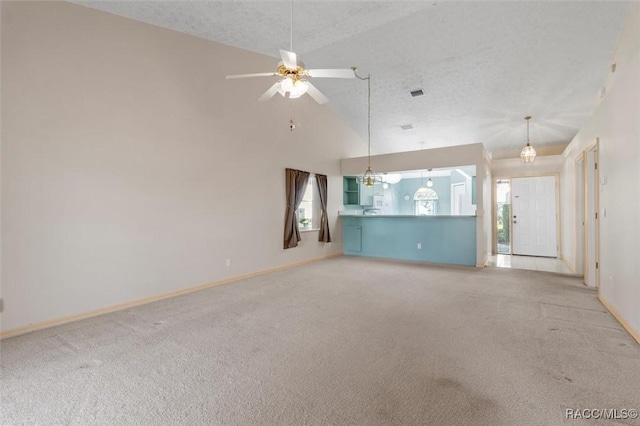 unfurnished living room featuring visible vents, a textured ceiling, carpet floors, baseboards, and ceiling fan