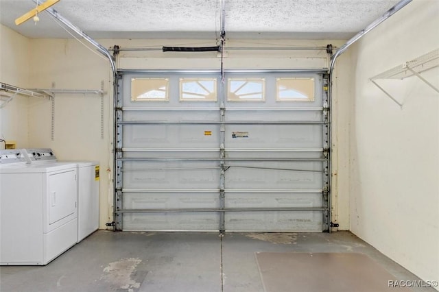 garage with washing machine and dryer