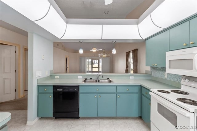 kitchen with white appliances, light countertops, ceiling fan, and a sink