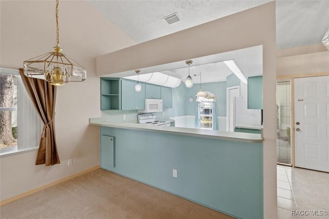 kitchen featuring white appliances, visible vents, decorative backsplash, a notable chandelier, and light colored carpet