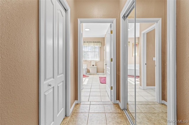 corridor with light tile patterned floors