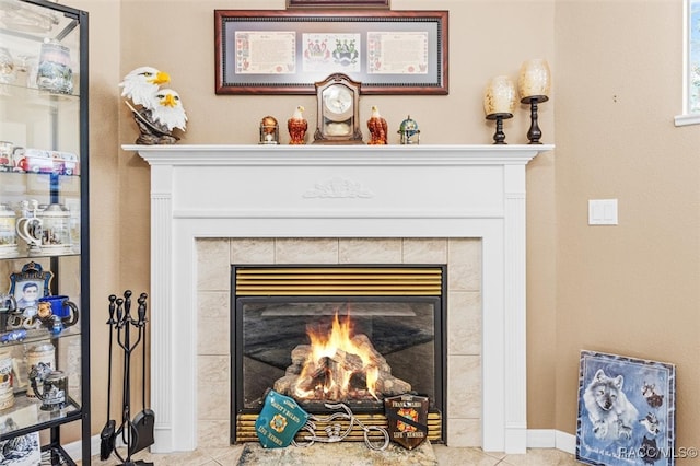 room details featuring a tile fireplace