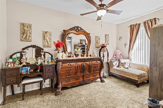 sitting room with carpet and ceiling fan